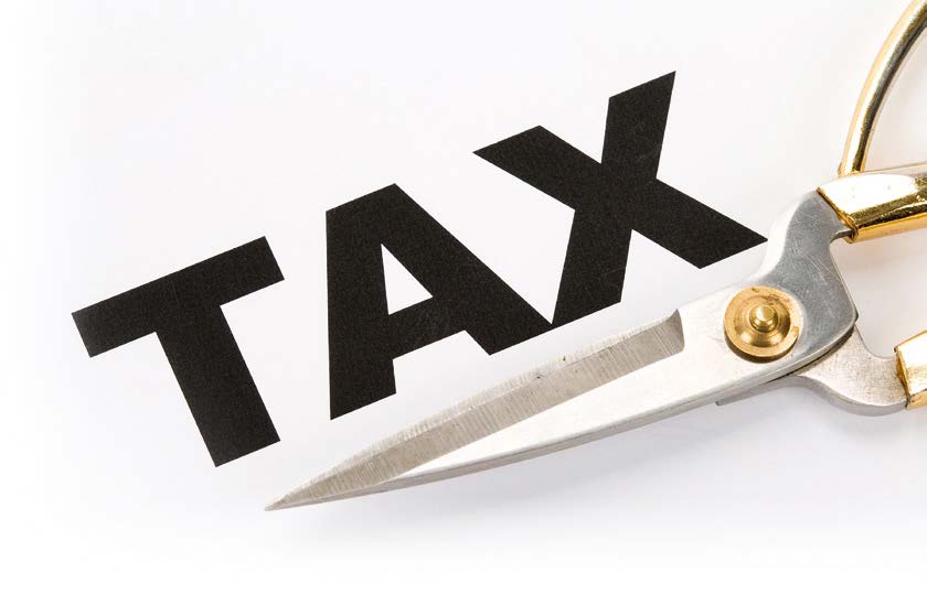 Photo of scissors under the word Tax
