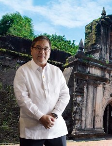Photo of DoT Sec Ramon Jimenez in front of Intramuros