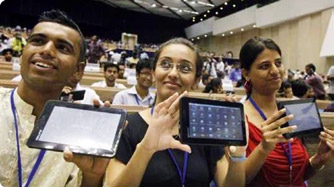 Photo of audience of students holding up their tablets