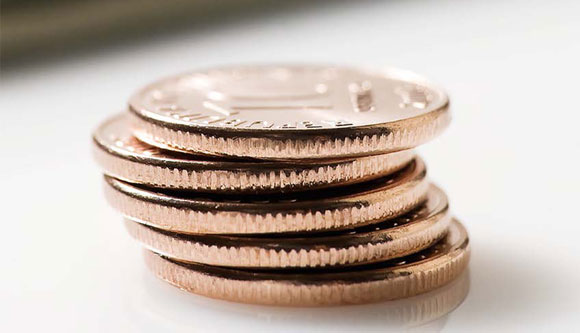 Photo of coins to represent earned incom