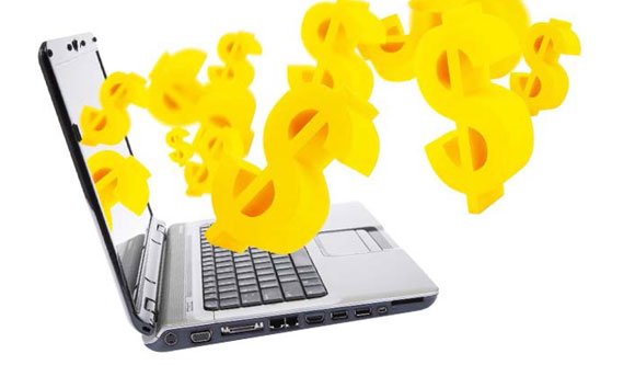 Photo of laptop with dollar signs coming out of the monitor