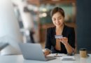 CCAP stock photo of woman looking at credit card